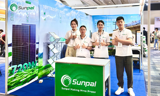Sunpal booth with four staff members at a trade show.